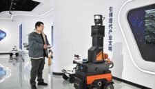 A staff member of Tianjin Siasun Intelligent Technology operates a mine inspection robot in the Beijing-Tianjin Zhongguancun Tech Town in Tianjin.