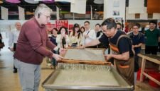 H.E. Mr. Karlis Eihenbaums,ambassador of Latvia to China, tries his hand at the traditional craft of Xuan papermaking.